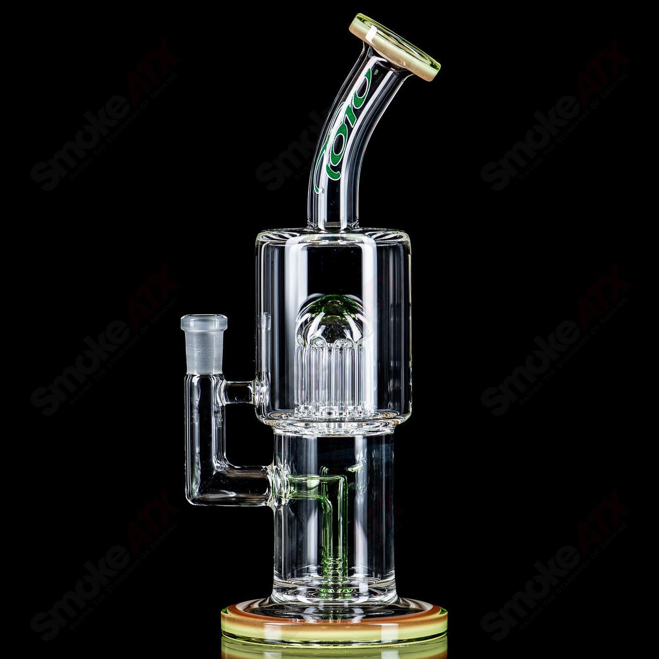 Toro Glass 10mm double macro concentrate rig with colorful caps, showcasing intricate heady glass design and vibrant accents.