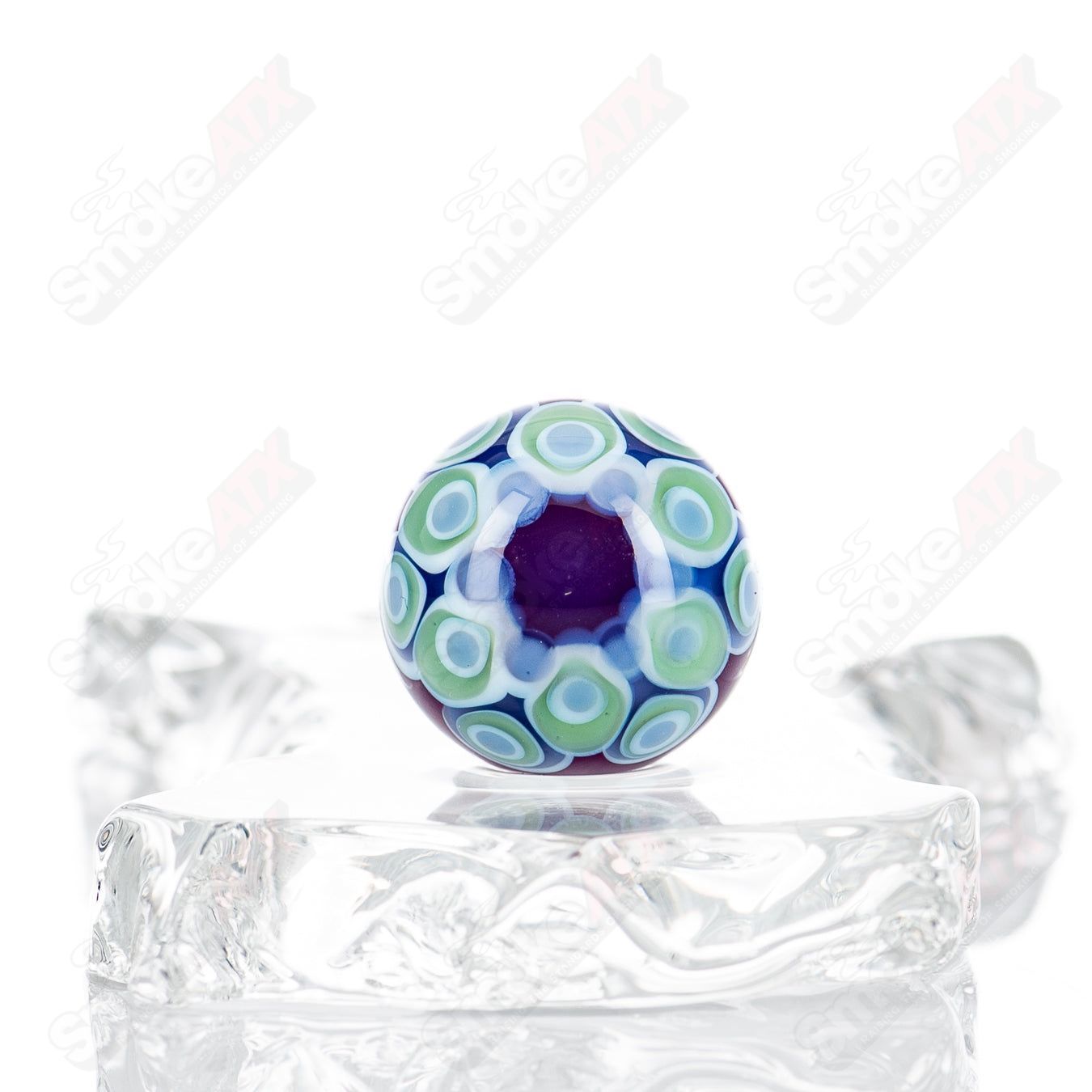 Clear glass marble with a single stacked dot design from Indo Glass, part of the #1 Dot Stacked Top MIB collection.