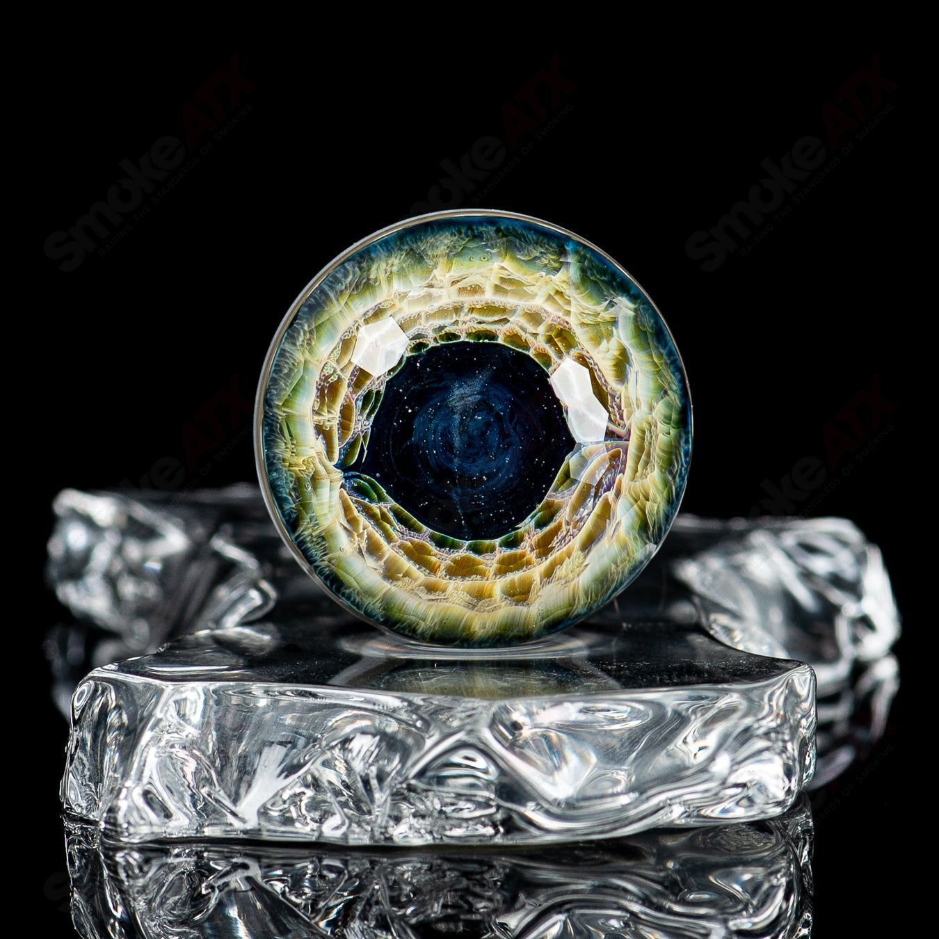 Faceted eye marble by Indo Glass from Fatal Facets collection, featuring intricate glasswork and vibrant colors.