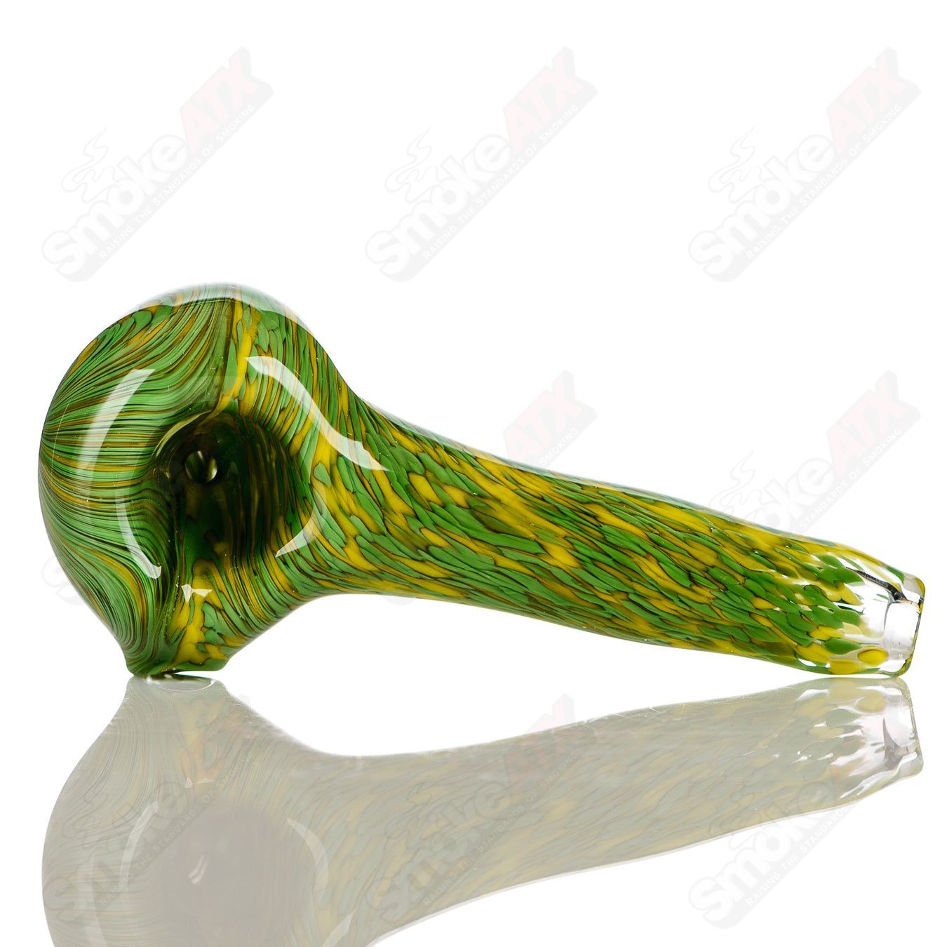 Green and yellow worked frit glass pipe spoon by JMK Glass with signature, featuring vibrant color patterns and intricate glasswork.