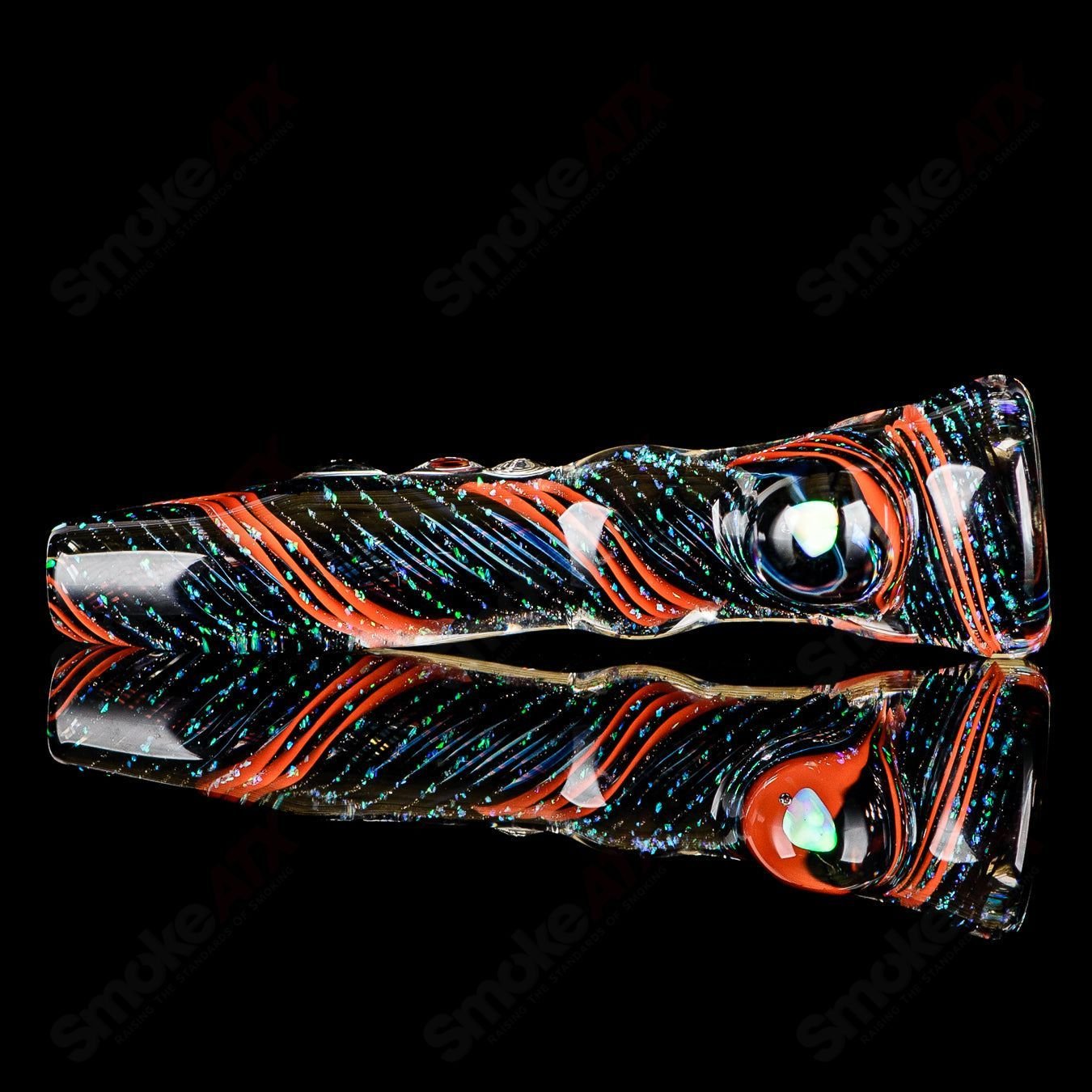 Glass Chillum by Rotational Science featuring a striking opal hitter design, showcasing clear glass craftsmanship.