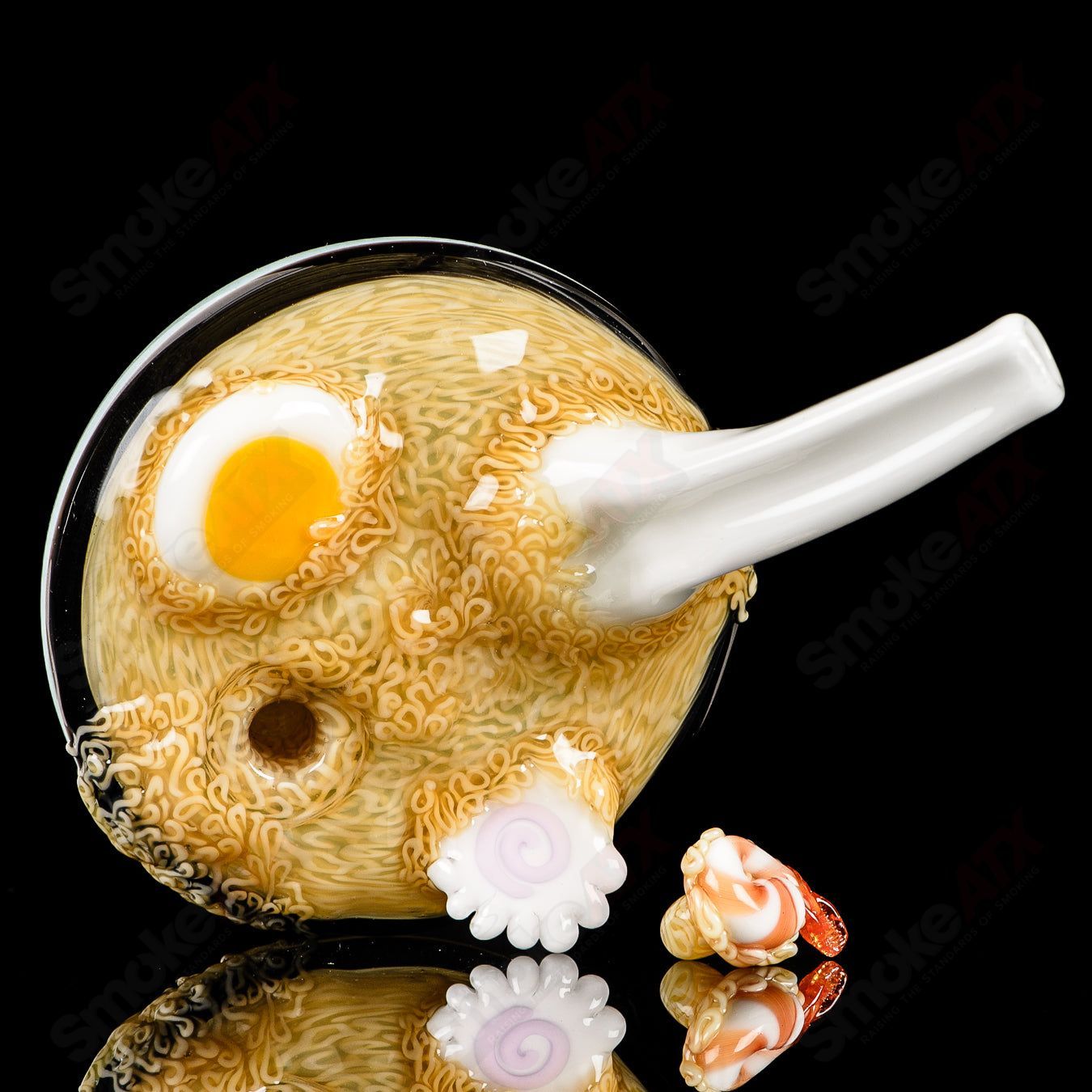 Dojo Glass Ramen Rig, a colorful heady glass concentrate rig with intricate ramen bowl design and clear glass accents.