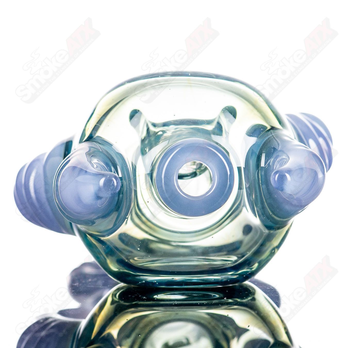 JMK Glass Sceptre Steam Roller Spoon made of clear glass, featuring a detailed steam roller design for hand pipe use.