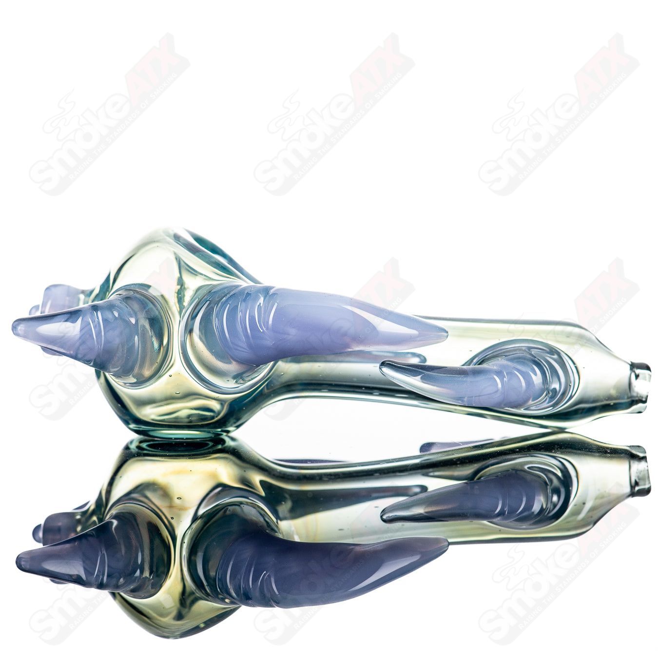 JMK Glass Sceptre Steam Roller Spoon made of clear glass, featuring a cylindrical shape and intricate glasswork design.