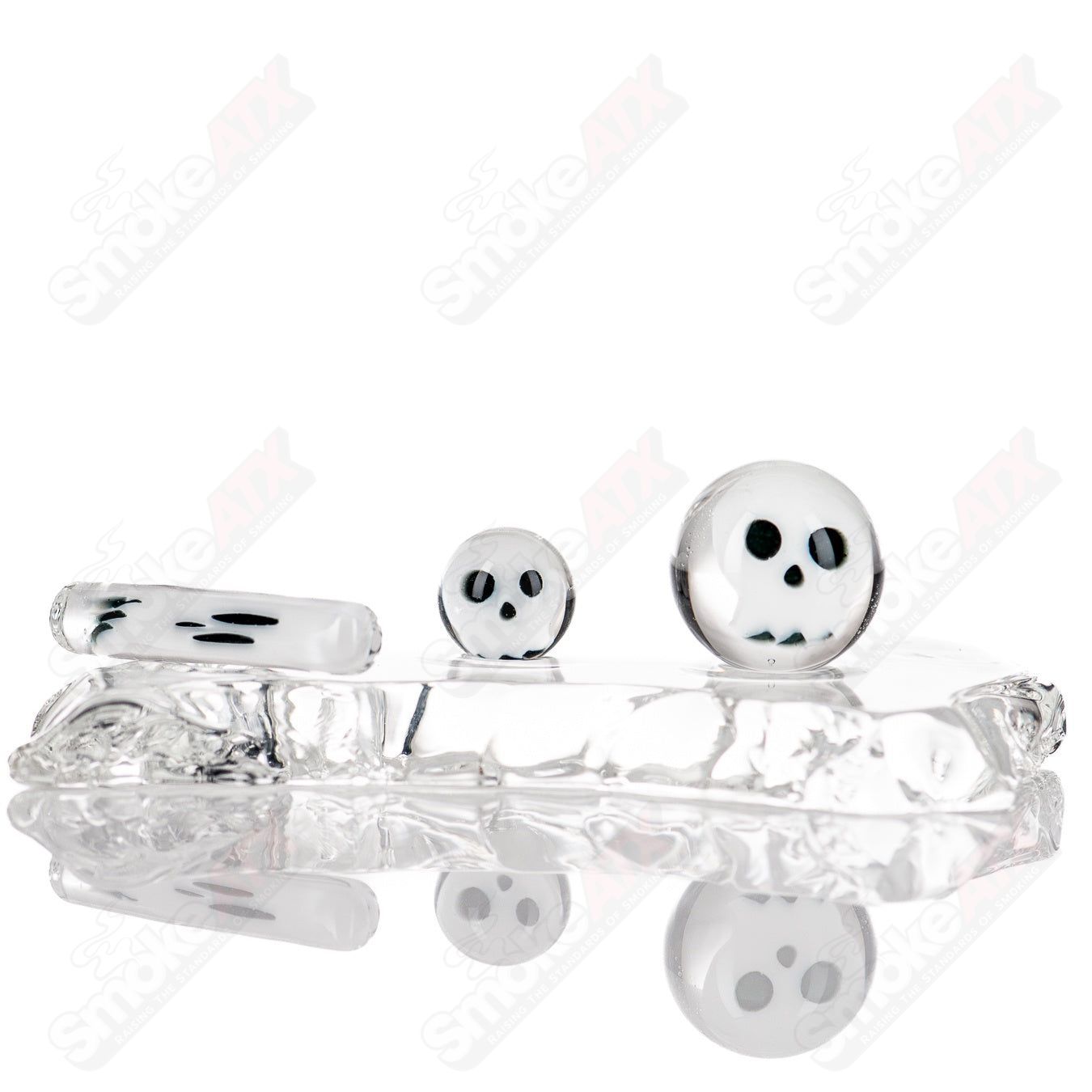 Glass Skull and Bones Slurper Set by Indo Glass featuring detailed skull and bones design for smoking or dabbing.