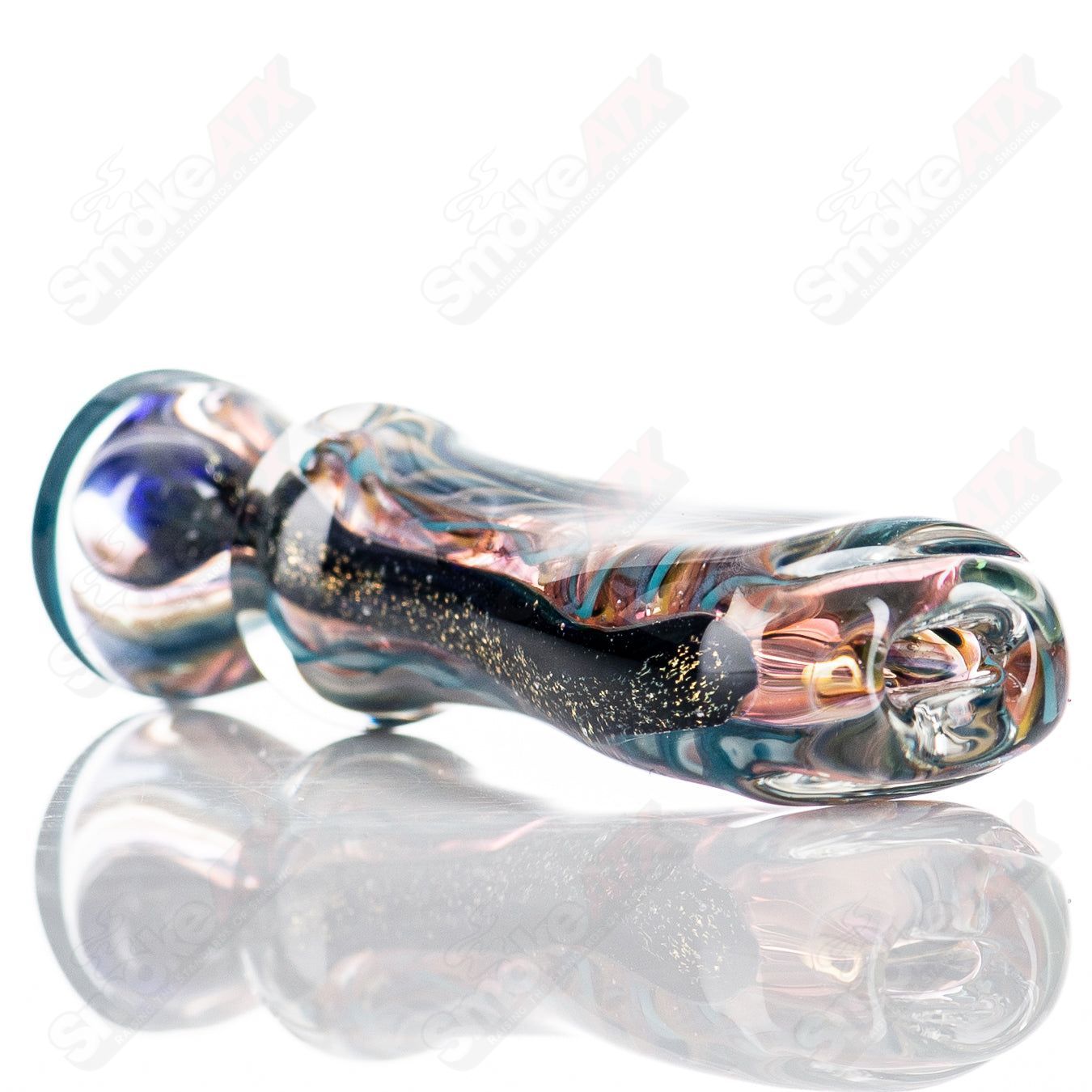 Molten Imagination glass Bat Chillum hand pipe, small ISO design with clear glass and intricate details, for smoking use.