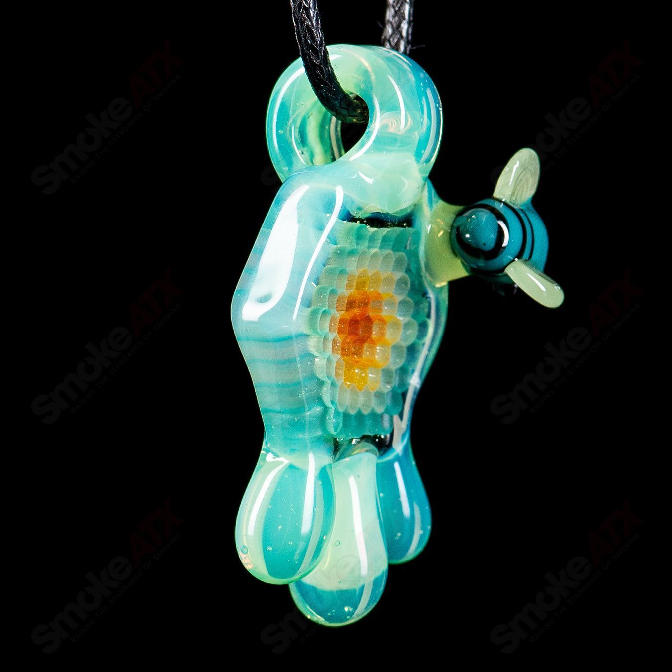 Small colorful honeycomb drip pendant by Joe P Glass, handcrafted heady glass jewelry with vibrant design and intricate details.