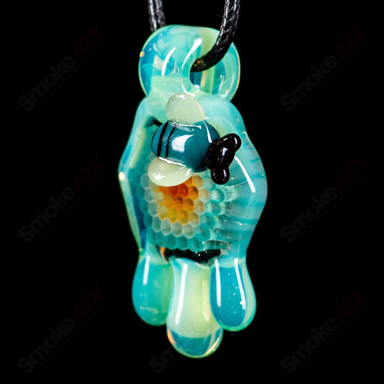 Small color honeycomb drip pendant by Joe P Glass, featuring vibrant glasswork and intricate design in a heady glass pendant.
