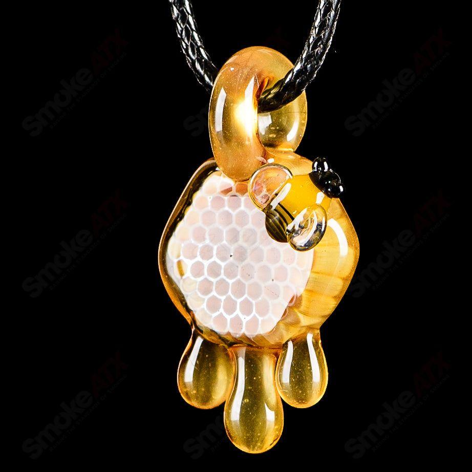 Small honeycomb drip pendant by Joe P Glass, colorful heady glass pendant with intricate honeycomb design, suitable for jewelry or display.