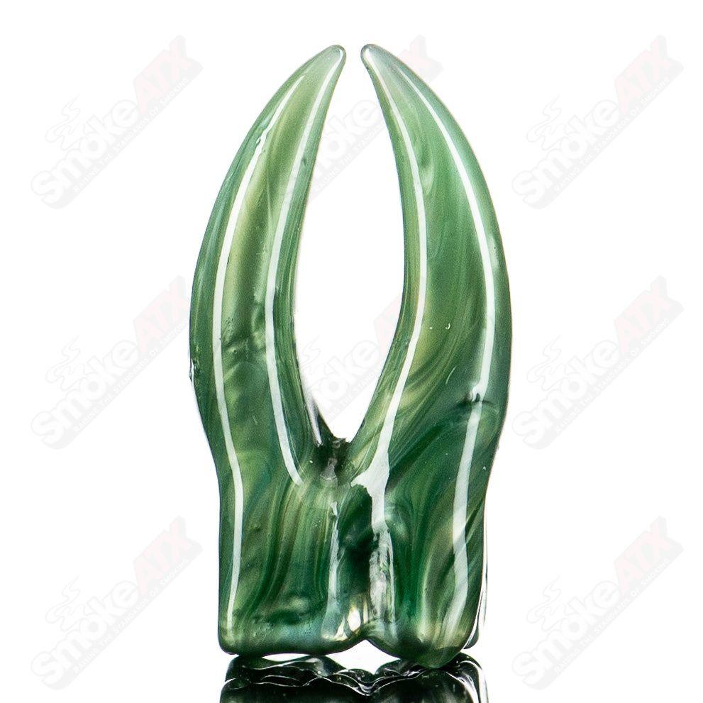 Teeth pendant made of grime glass, hanging as a unique jewelry piece, showcasing a detailed and artistic glass design.
