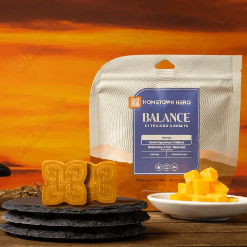Hometown Hero Mango Spectrum Delta-9 Gummies, hemp edibles with 100mg THC, colorful mango-flavored gummy candies on a white background.
