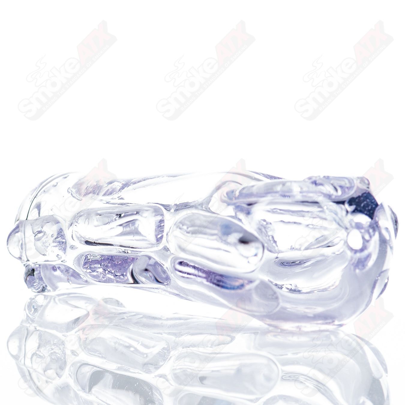 Spoon-shaped glass pipe by Nobody, transparent glass with smooth curves, designed for smoking use.