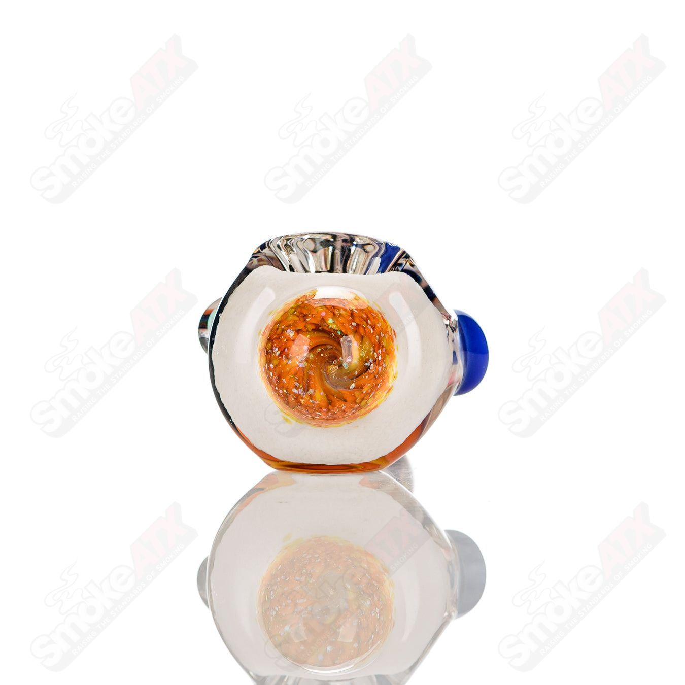 Colorfully worked IO spoon hand pipe by Jeremy from Oregon featuring 12 vibrant colors and intricate glass detailing.