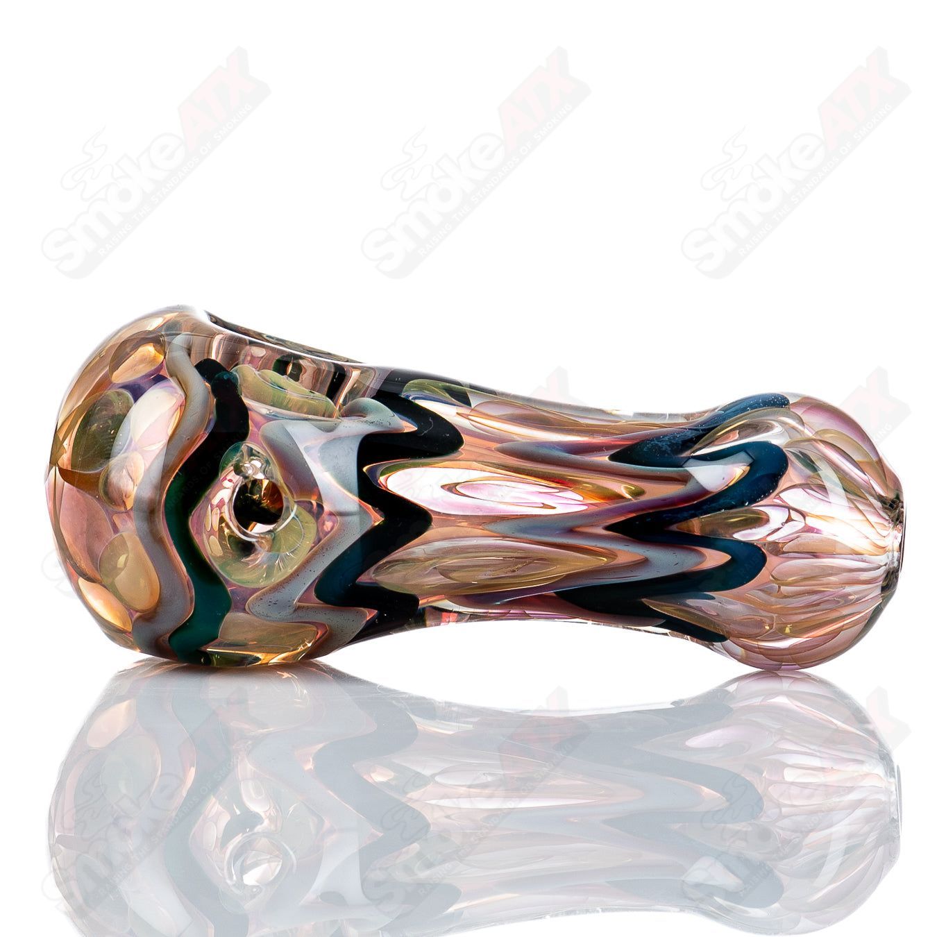 Glass pipe with gold and silver fume design, Shane Smith #12 I/O spoon pipe, featuring intricate color patterns and a smooth shape.