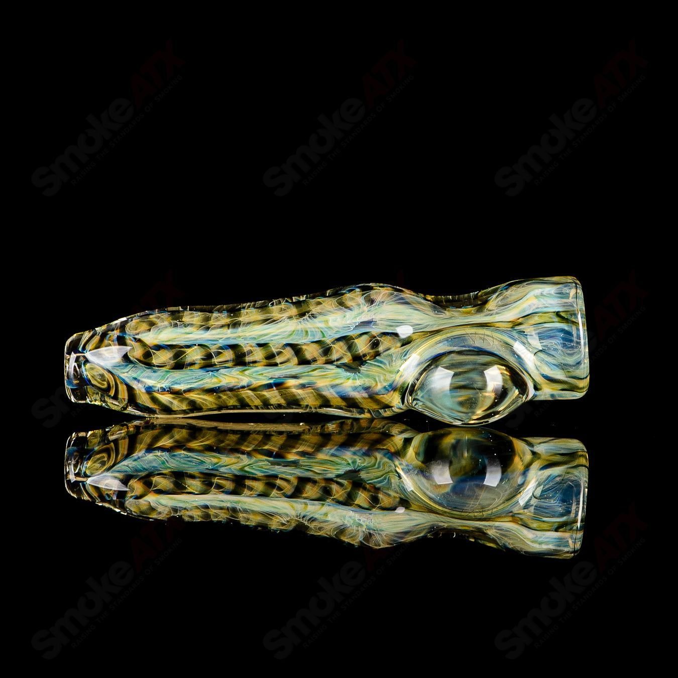 Glass chillum with signed JMK Glass branding, featuring intricate worked glass design and a clear, cylindrical shape.