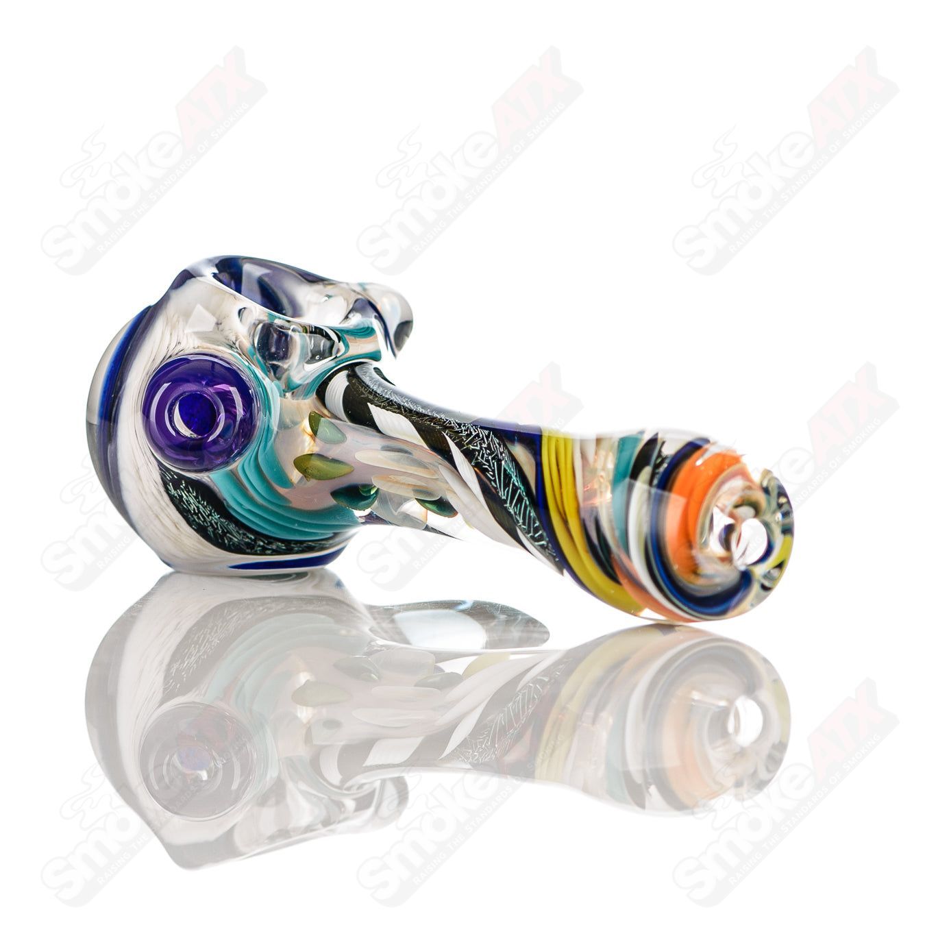 Colorfully worked IO spoon hand pipe by Jeremy from Oregon with 13 vibrant color patterns and intricate glass designs.