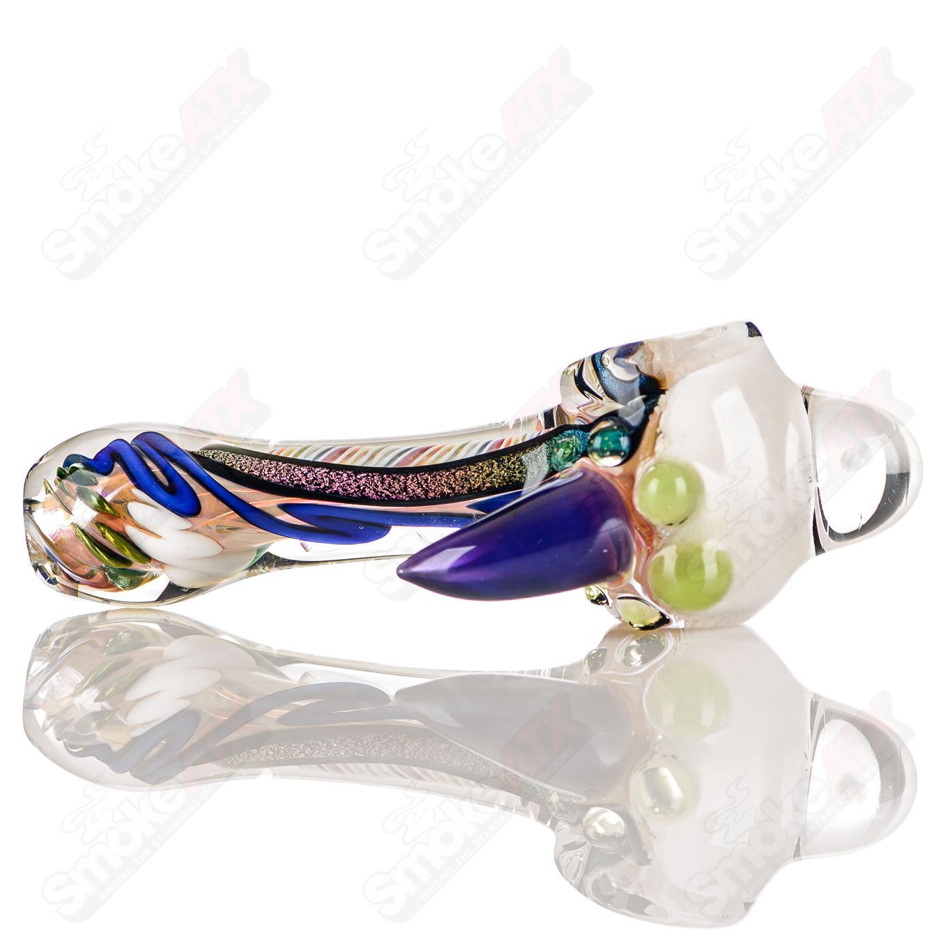 Colorfully worked IO spoon hand pipe by Jeremy from Oregon with 14 vibrant colors and intricate glass design.