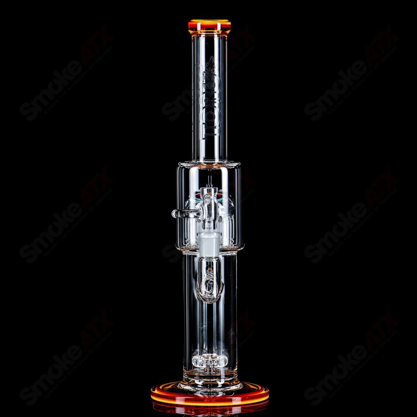 Toro Glass 14mm circular to 13-arm perc straight tube with reversal sections, featuring intricate glasswork and clear accents.