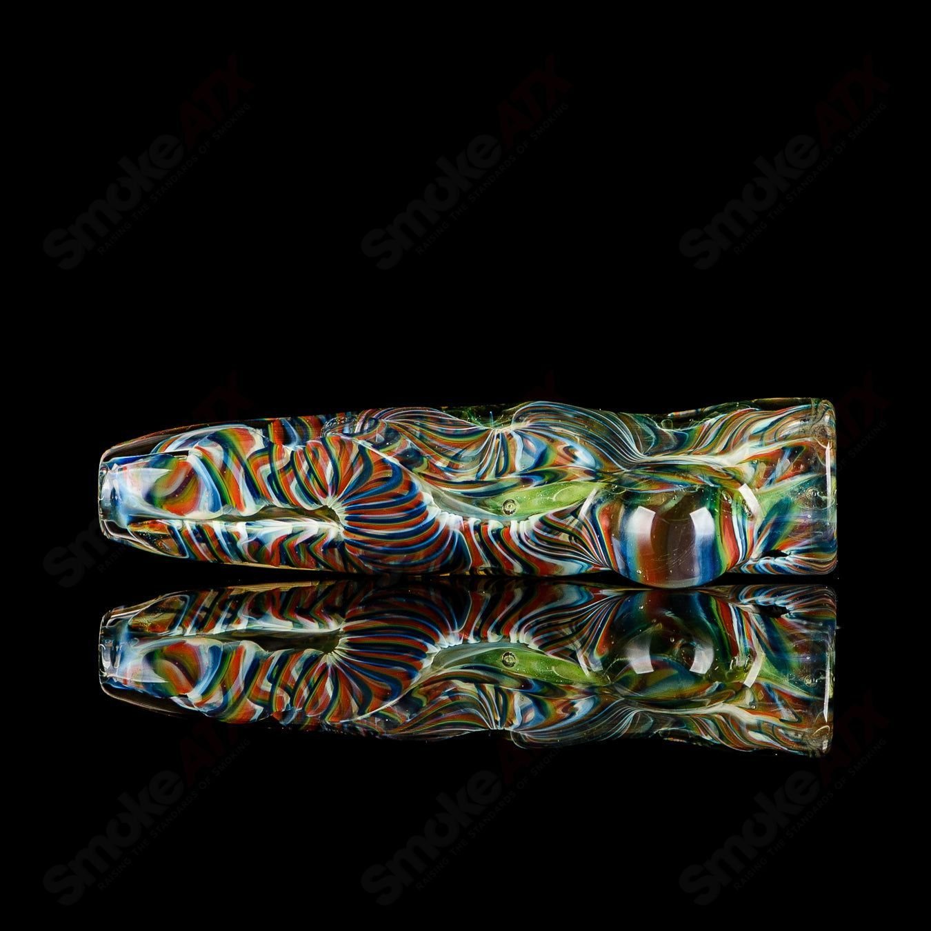 Signed JMK Glass I/O Worked Chillum, clear glass smoking pipe with intricate worked design and signature details.