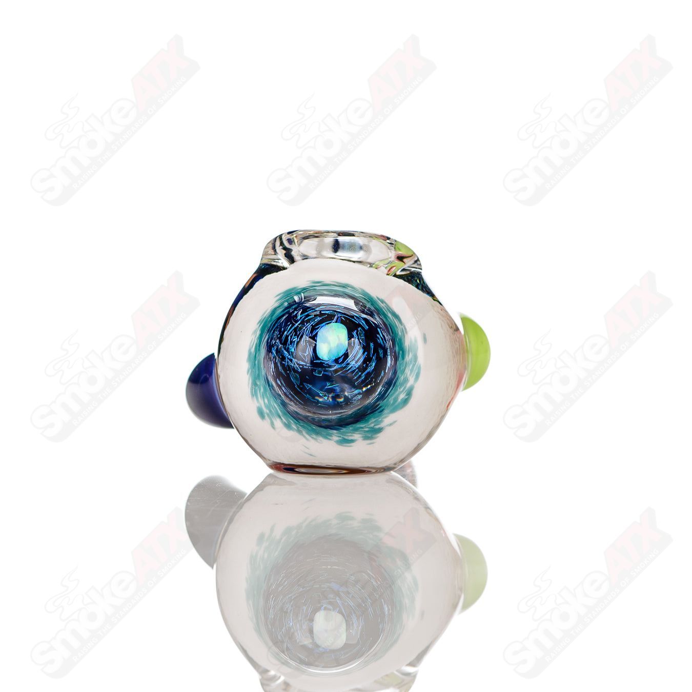 Colorfully worked IO spoon hand pipe by Jeremy from Oregon with vibrant 16-color design and smooth glass finish.