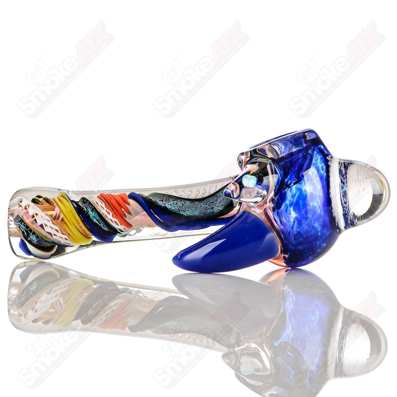 Colorfully worked IO spoon hand pipe by Jeremy from Oregon with intricate 17-color design, made of heady glass.