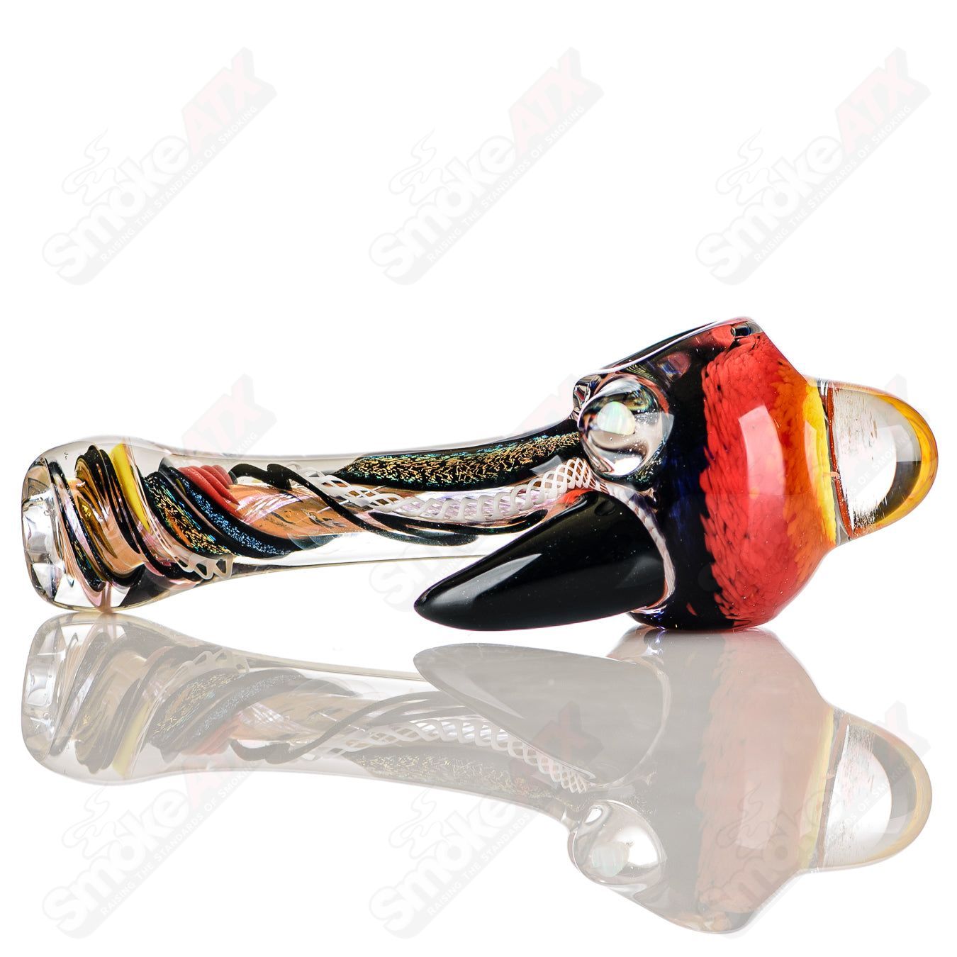 Colorfully worked IO spoon hand pipe by Jeremy from Oregon with vibrant 18-color design, made of heady glass.
