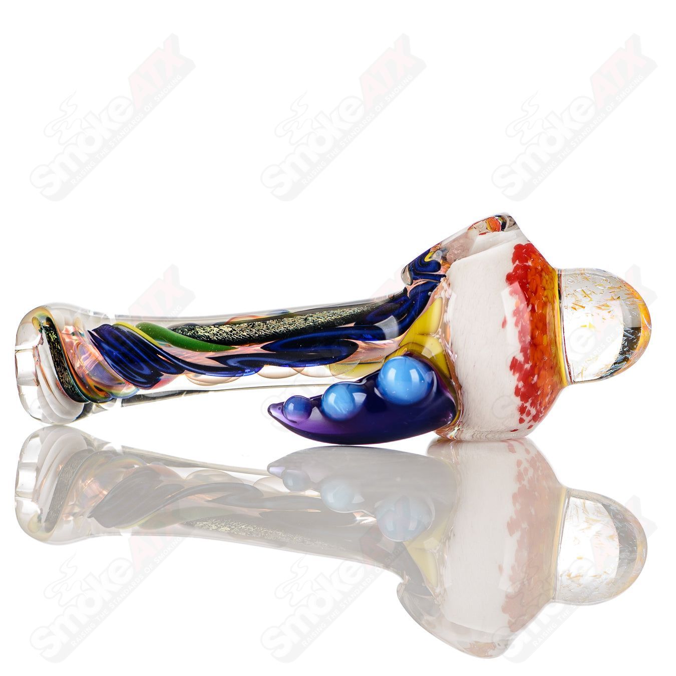 Color worked IO spoon pipe by Jeremy from Oregon, handcrafted glass hand pipe with vibrant, intricate 19-color design.