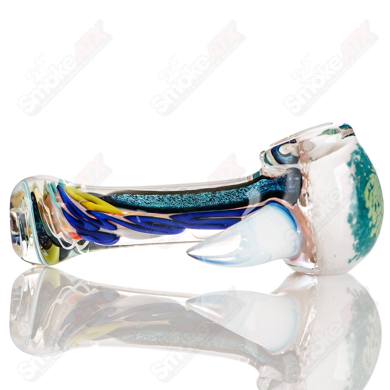 Colorfully worked IO spoon hand pipe by Jeremy from Oregon, featuring vibrant two-tone glass design and intricate craftsmanship.