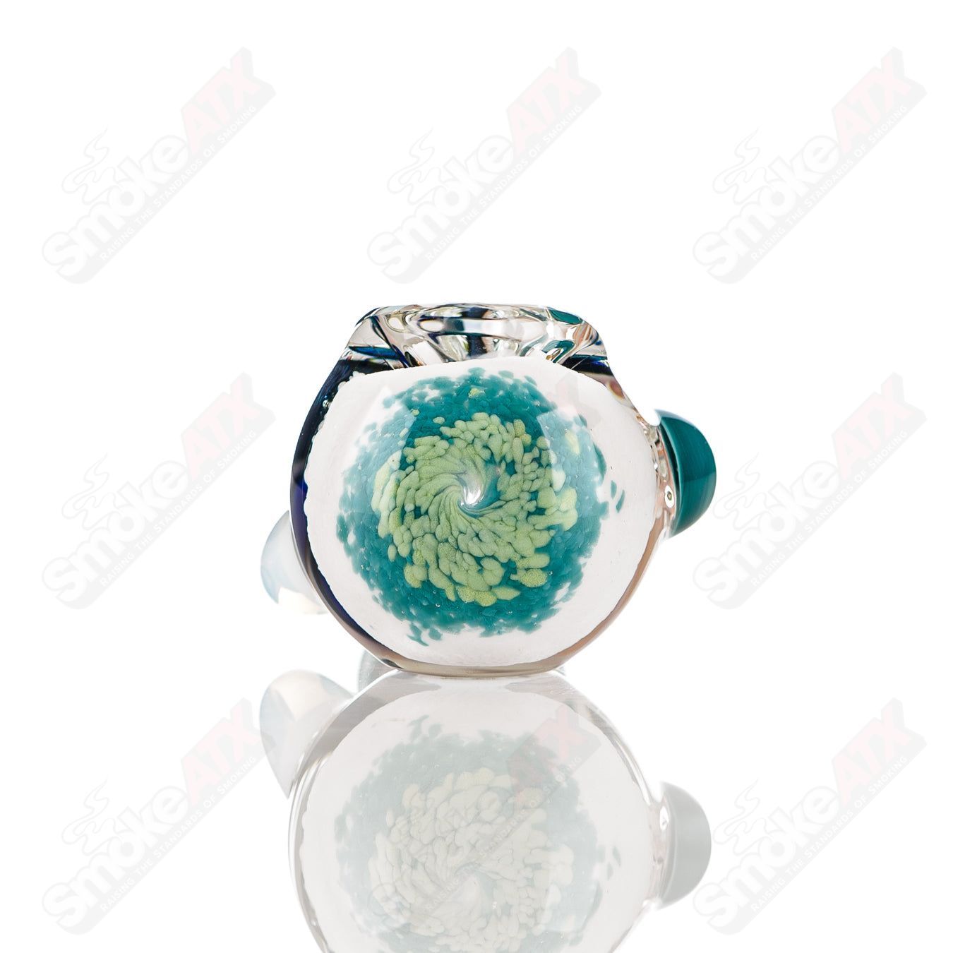 Color-worked IO spoon hand pipe by Jeremy from Oregon with blue and clear glass, featuring intricate design and smooth bowl.