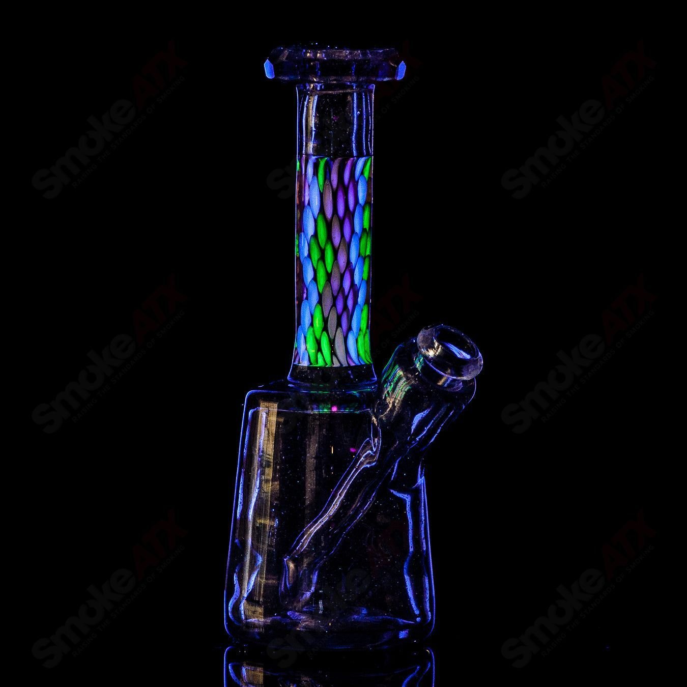 Faceted UV/CFL mini concentrate rig made of BCM Glass, featuring colorful heady glass design and intricate glasswork.