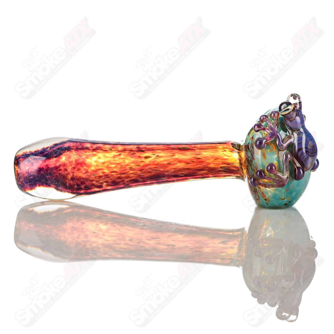 Beezy Glass Frog Spoon pipe made of clear glass with a detailed frog design, suitable for smoking.