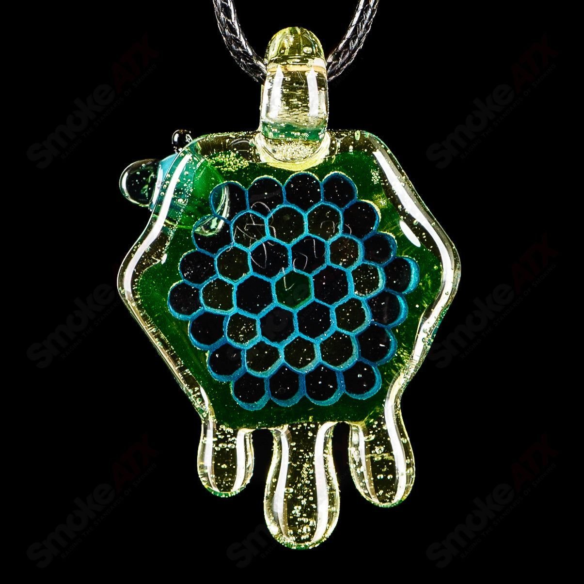 Teal and UV green-yellow 2-inch Honeycomb Drip Pendant by Joe P Glass, colorful heady glass pendant with honeycomb design.