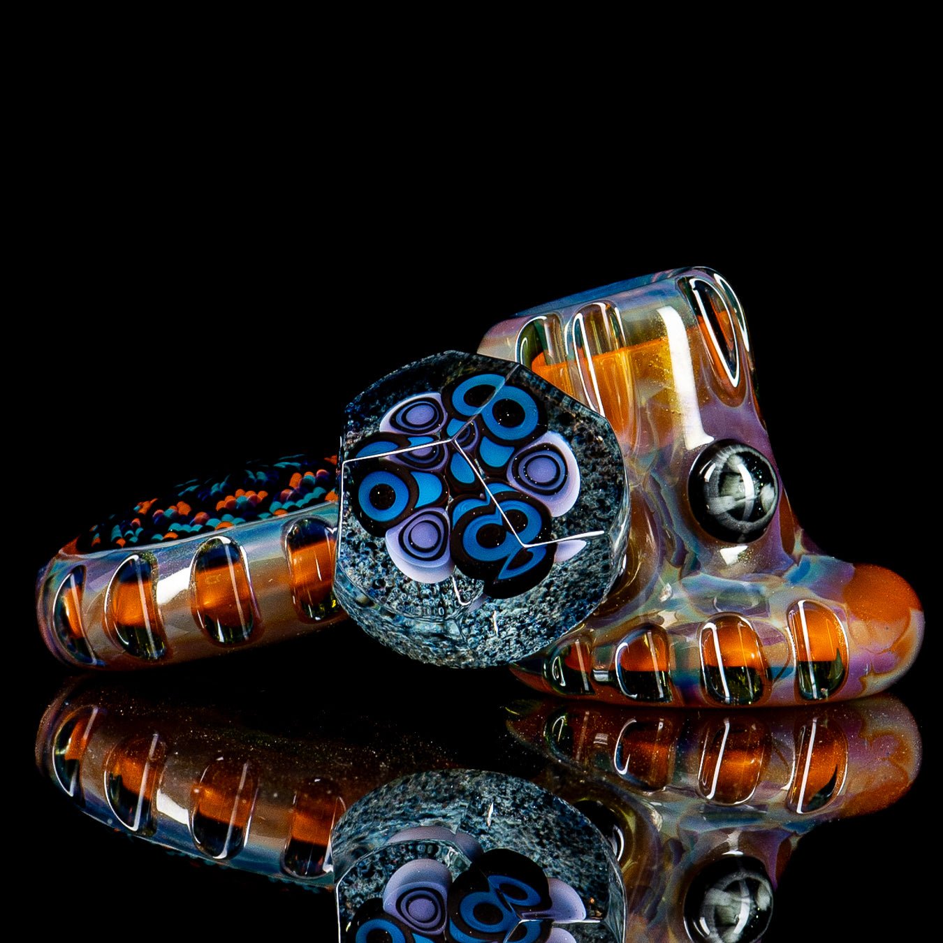 Hand pipe from Rotational Science's Heady Glass series, Dottacello design with two pockets and colorful glass details.
