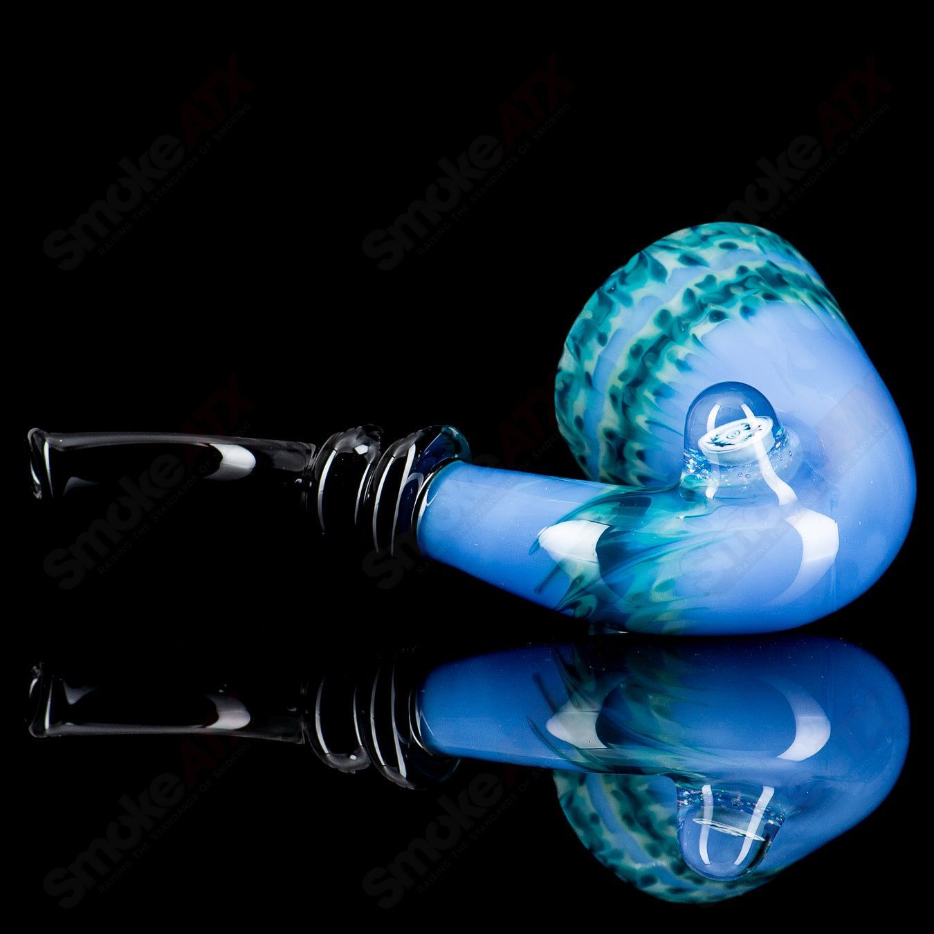 Sherlock style heady glass pipe with Milli accent by JMass, featuring a detailed Sherlock design and clear glass construction.