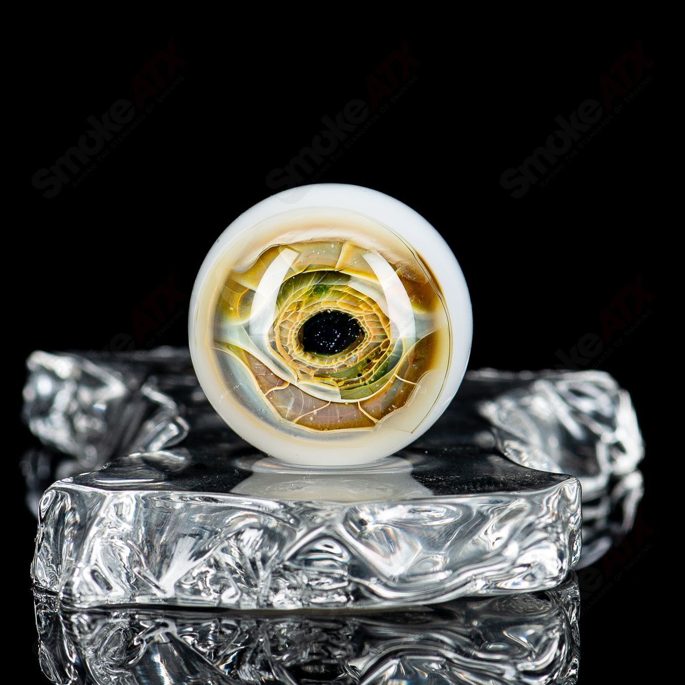 Indo Glass Skull Eye Mili Top Marbles heady glass piece with colorful skull and eye designs, featuring intricate glass marbles.