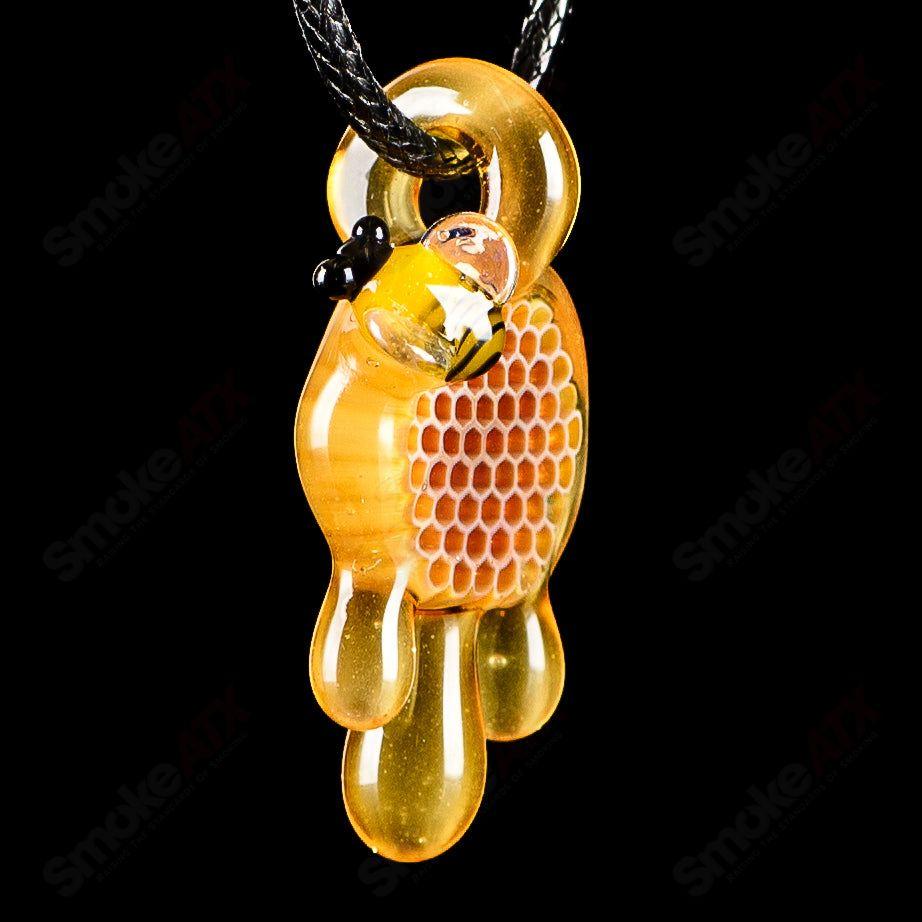 Small honeycomb drip pendant by Joe P Glass, handcrafted heady glass jewelry featuring a detailed honeycomb design.