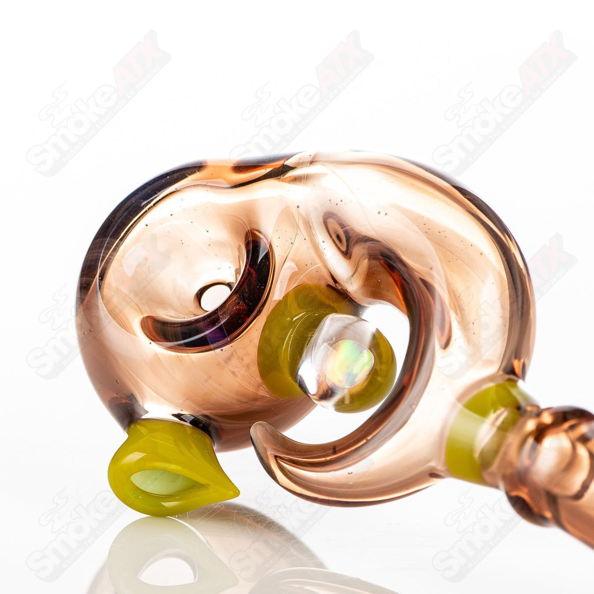 Handheld Swooplock pipe by GK Melts, made of clear heady glass with a smooth curved design for easy grip and stylish appearance.