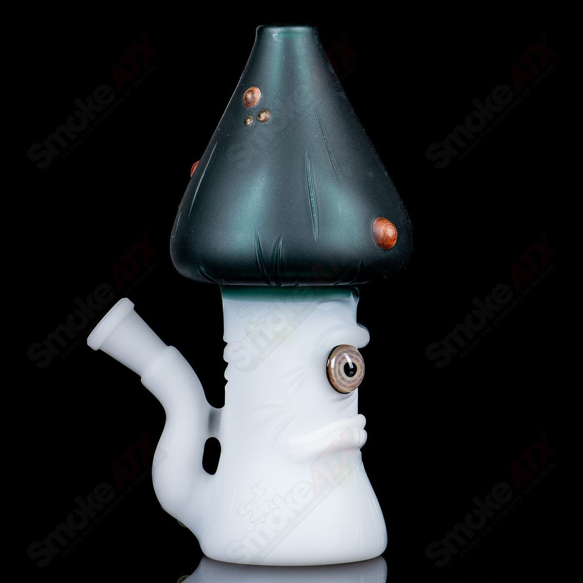 UV-reactive Grumpy Mushroom Rig by Space Glass, colorful glass concentrate rig with mushroom design and vibrant UV glow.