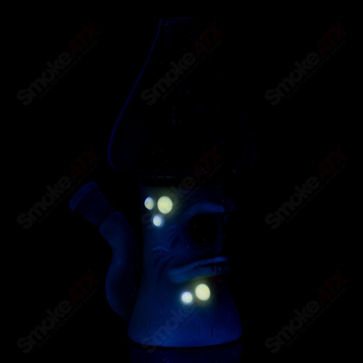 UV-reactive glass Grumpy Mushroom Rig by Space Glass, a colorful concentrate rig with mushroom and UV glow effects.