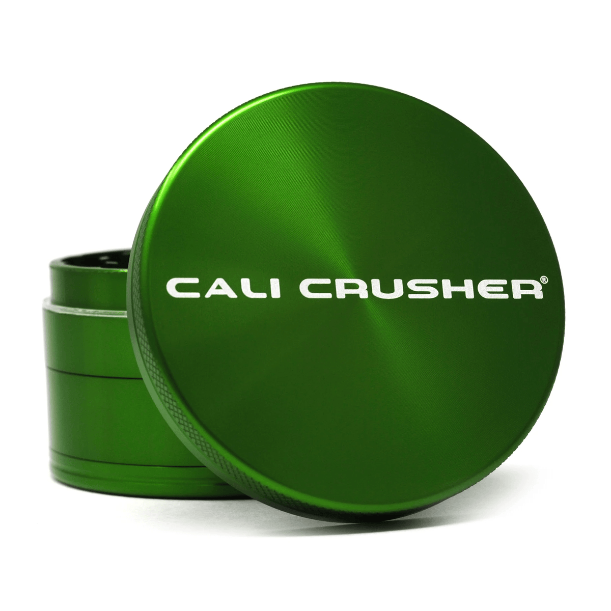 Green Cali Crusher 2.5-inch 4-piece hardtop metal grinder with sharp teeth for grinding herbs and spices.