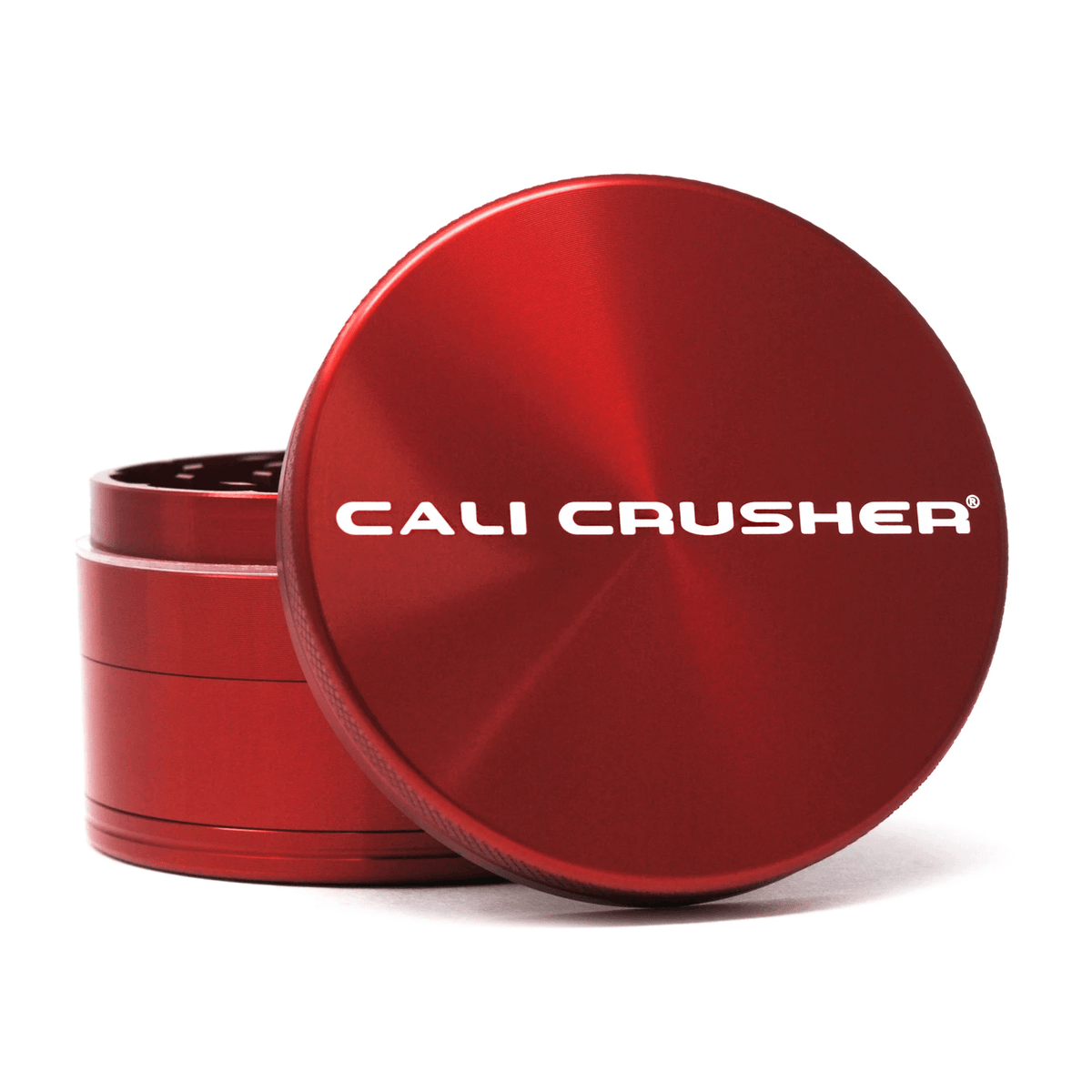 Red 2.5-inch Cali Crusher 4-piece metal grinder with hardtop, designed for precise grinding and storage of herbs.