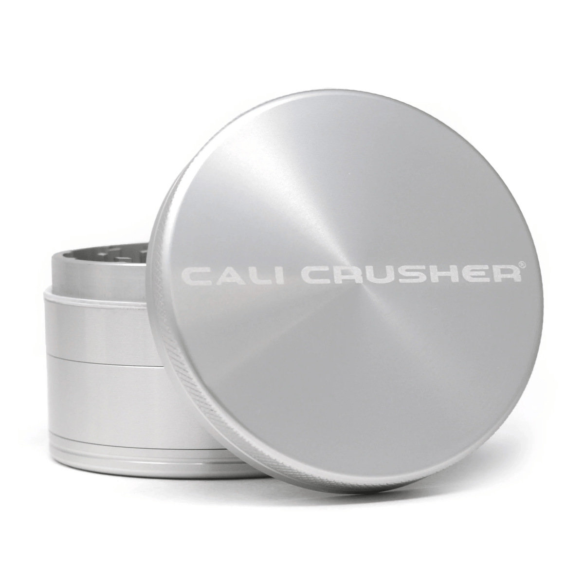 Silver 2.5-inch Cali Crusher 4-piece metal grinder with hardtop for herbs, featuring durable construction and multiple grinding chambers.