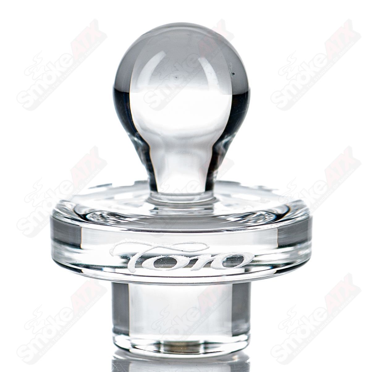 Clear 25mm UFO glass carb cap by Toro Glass, designed for smoking accessories, with a smooth rounded shape and transparent finish.