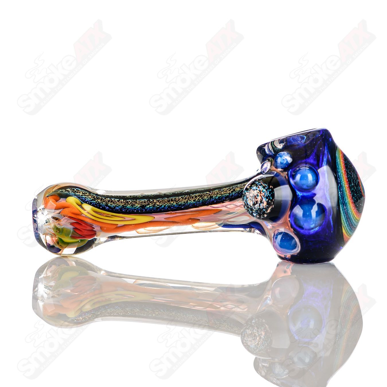 Colorfully worked IO spoon hand pipe by Jeremy from Oregon with vibrant 26-color design and smooth glass finish.