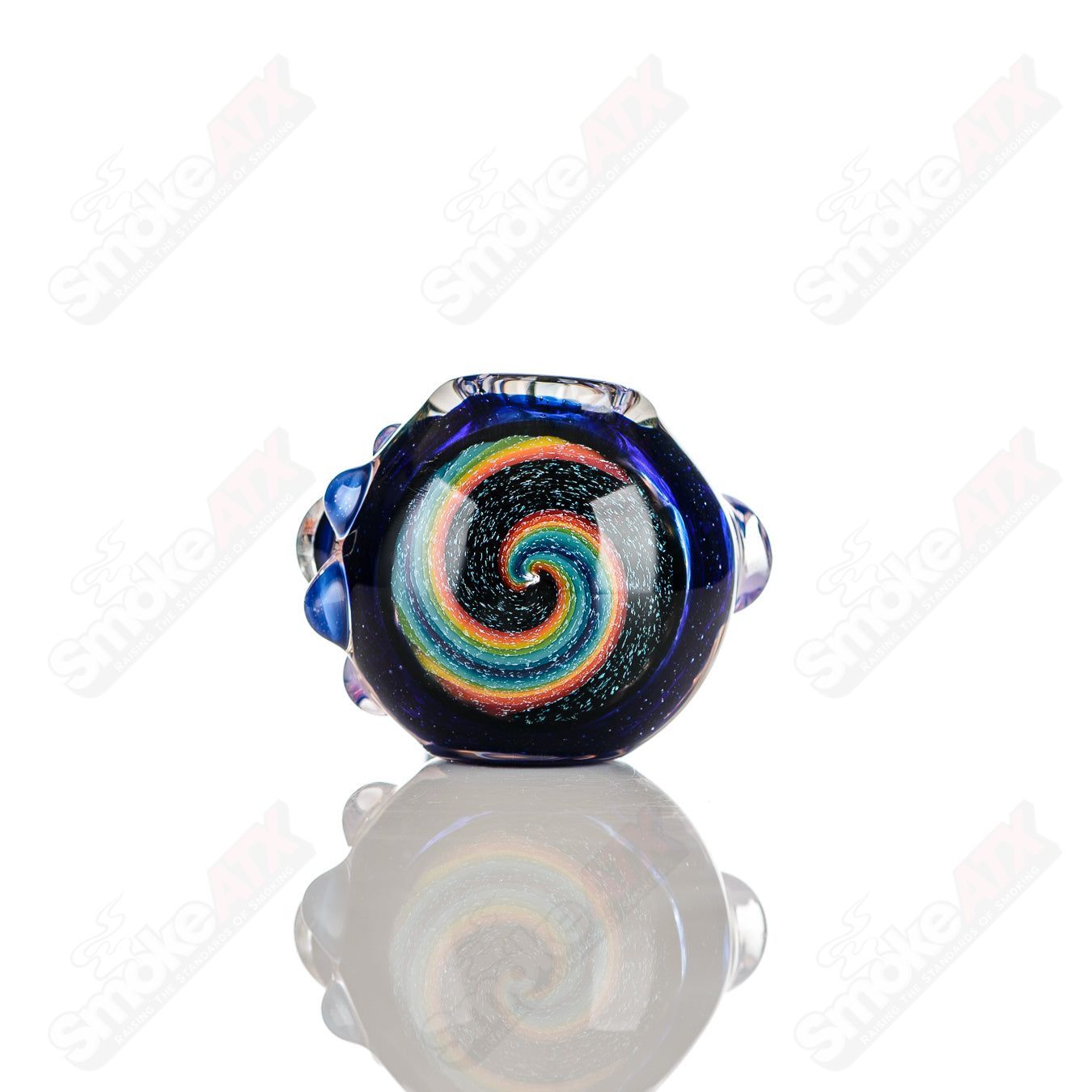 Color-worked IO spoon pipe by Jeremy from Oregon, hand-blown glass heady pipe with vibrant 26-color design and ergonomic shape.