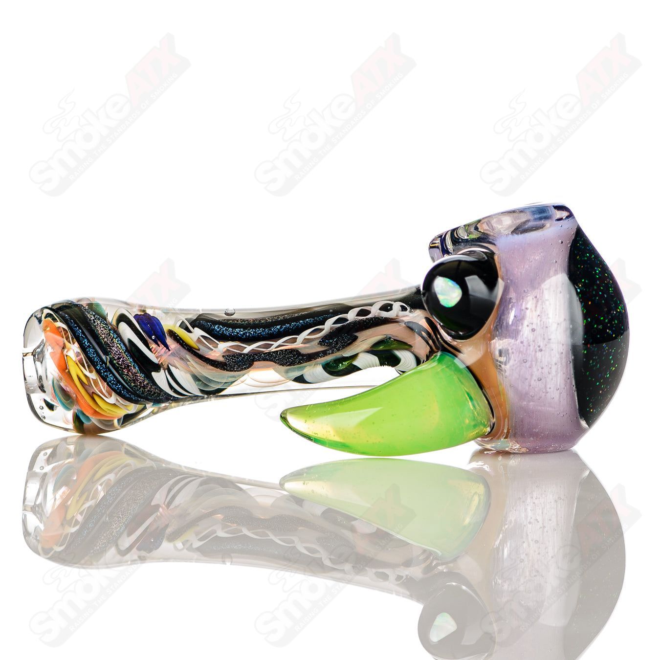 Colorfully worked IO spoon hand pipe by Jeremy from Oregon with intricate 27-color design, made of durable heady glass.