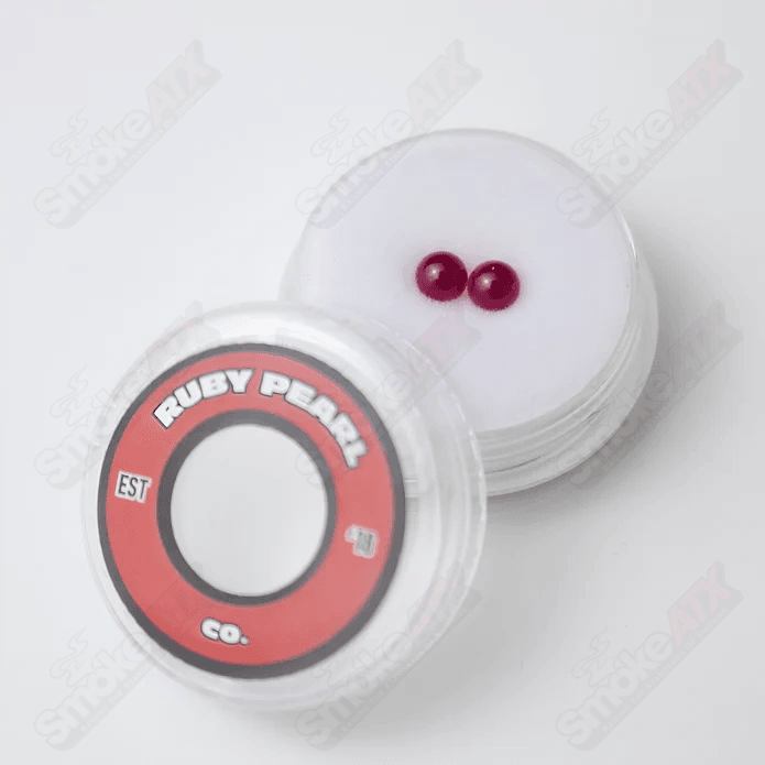 Two 4mm ruby glass pearls from Ruby Pearl Company, round with a rich red color, suitable for jewelry making.
