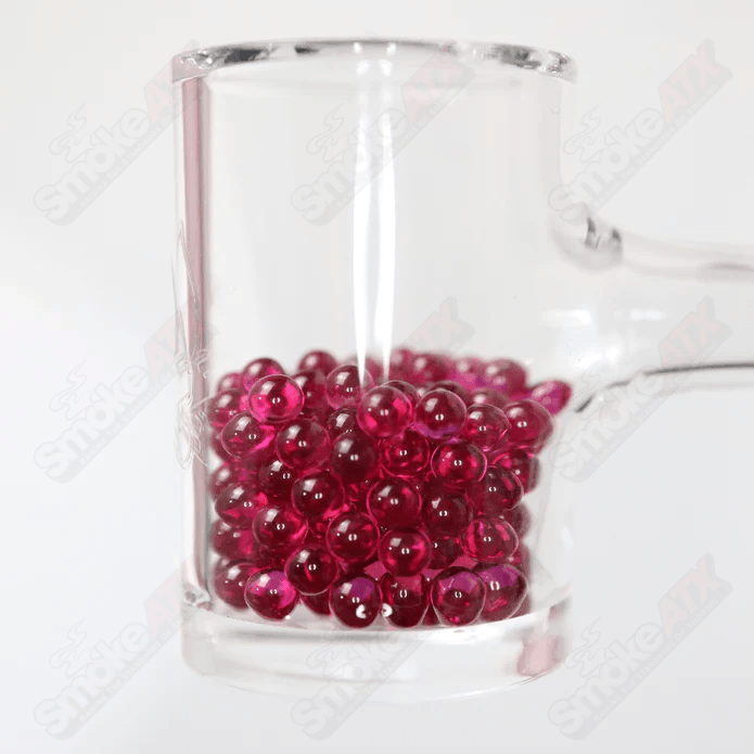 Two 4mm ruby glass pearls from Ruby Pearl Company, featuring smooth, shiny red gemstone-inspired beads for jewelry making.