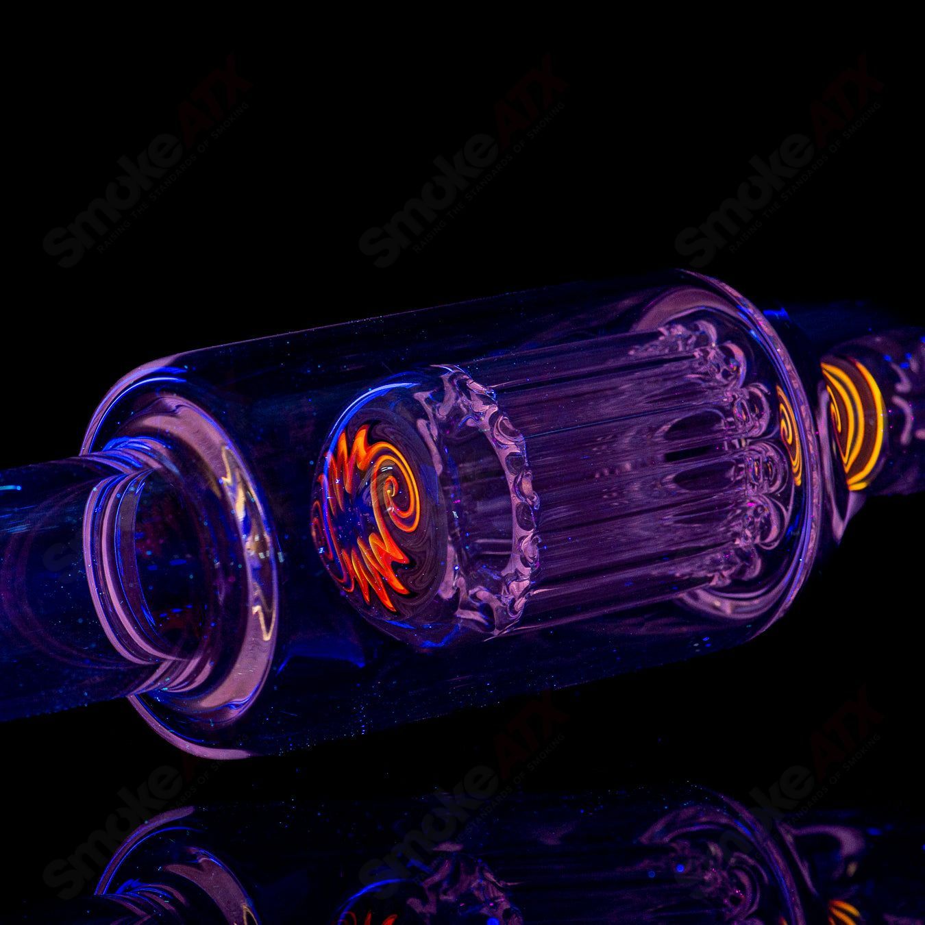 Toro glass straight tube with 18mm 7/13 arm perc and reversal caps, featuring clear glass design and intricate percolation details.