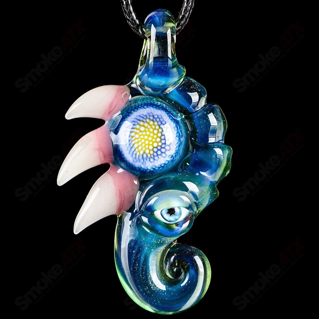 Three pendant-shaped Dosa glass pieces by Salt Glass, featuring colorful, artistic heady glass designs.
